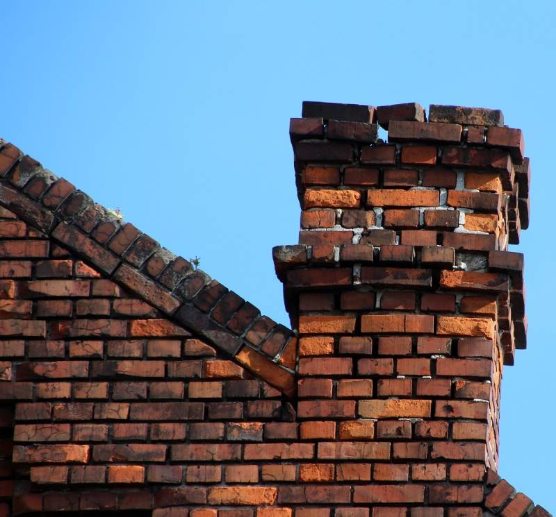 Signs Your Capistrano Beach Home Needs a Chimney Inspection Damaged chimney on an Capistrano Beach home showing cracks and missing mortar